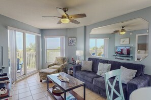 Comfortable Living Room with Plenty of Seating, TV, and Beautiful Views.
