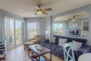 Comfortable Living Room with Plenty of Seating, TV, and Beautiful Views.