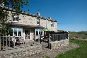 Heatherdene - front aspect with patio and garden furniture