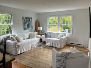 Sunny family room sitting area open to dining and kitchen
