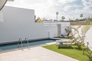 Garden with barbecue, seating area, sunloungers and private pool