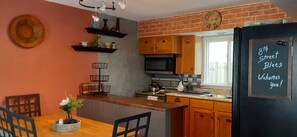 kitchen with cooking supplies and seating for 7