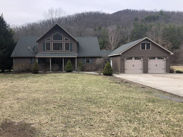 Front view of home.  The Pine Creek Rail Trail borders the front.