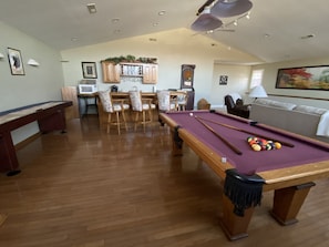 Game Room full size pool table and bar area
