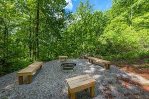 Fire pit area in the backyard with seating for up to 6.