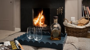 Wood Cottage - relax in front of the fire with a glass after a busy day exploring