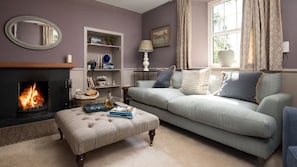Wood Cottage - cosy sitting room with open fire, large sofa and Smart TV