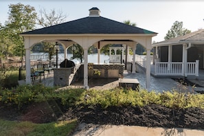 Outdoor kitchen with 2 grills, 2 fire pits and seating areas