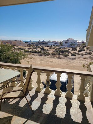 Upstairs entry landing ocean views. Only
1 lot between you & the beach!