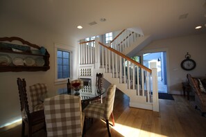 breakfast nook looking through the stair case into the back patio