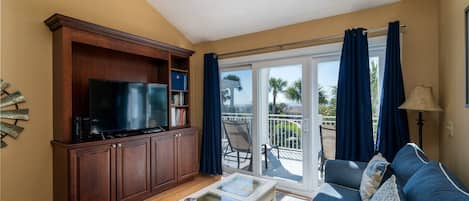 This Atrium Villa has an open floor plan with ocean views visible from multiple sliding doors leading to the deck.