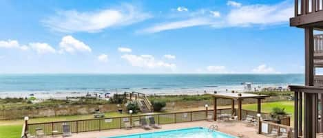 Direct ocean and pool view over private cozy balcony. 