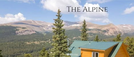 Embrace the unparalleled beauty of Mt. Sherman's 14,000' peak from Colorado's premier mountain chalet. This exquisite retreat offers panoramic vistas in a serene alpine setting.