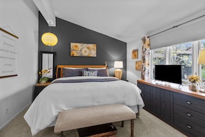 King size bed with room darkening shades and a ROKU TV with Spectrum cable TV