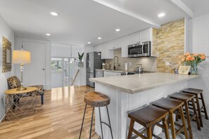 Enjoy cooking in this bright and airy fully stocked kitchen 
