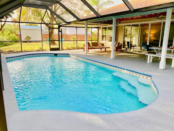 Amazing screened in solar heated pool and patio