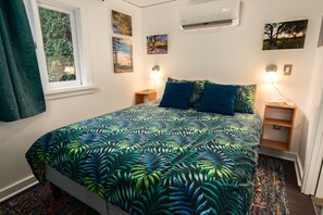 Read a book or take a nap in this cosy, luxurious Patio Cottage bed .