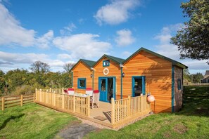 Berrington Beach Hut - front exterior with decked area for those sunshine days