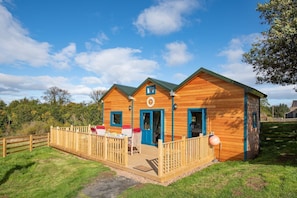 Berrington Beach Hut - front exterior with decked area for those sunshine days
