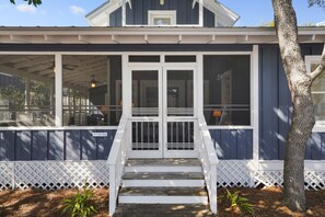 FRONT ENTRANCE WITH FURNISHED SCREENED PORCH