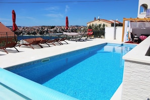 Pool. swimming pool-sun deck-patio-sun beds