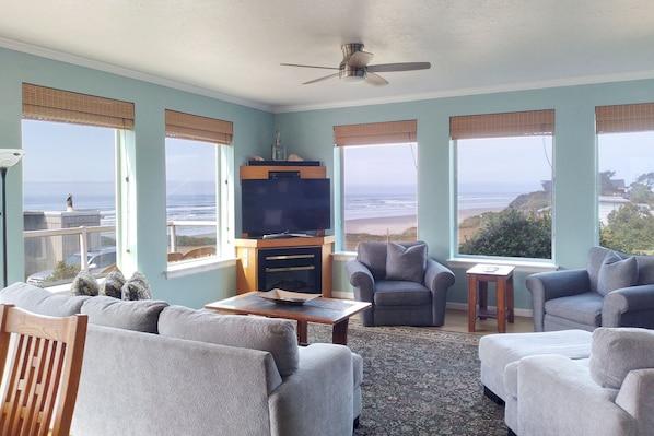 Relax in the living room with an ocean view.