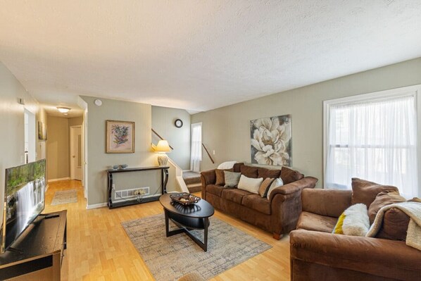 Warm andwelcoming living room with roku tv.