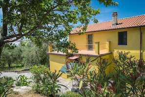 External view of the building. Entrance with parking in front of the door