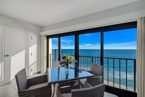 Breathtaking ocean views framed by floor-to-ceiling windows, creating a serene dining experience in this coastal retreat.