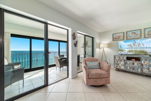 Seamless indoor-outdoor living with expansive glass doors leading to a balcony overlooking the mesmerizing ocean. The perfect blend of comfort and captivating scenery.