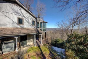 Our home is perched on the edge of a hillside and provides breathtaking views of the mountains beyond.