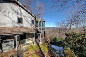 Our home is perched on the edge of a hillside and provides breathtaking views of the mountains beyond.