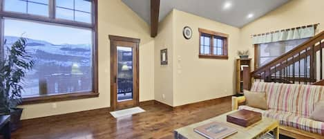 Dewey Placer Lodge - a SkyRun Breckenridge Property - Living room with vaulted ceilings, walk out patio and mountain views!