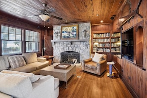 The fireplace and wood paneling walls give this property a classic feel.