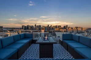 Private 600-square-foot outdoor deck and 360-degree views of Downtown Nashville with outdoor games, BBQ, cooler, plus outdoor seating.