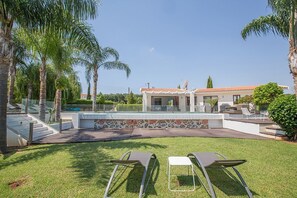 Garden with barbecue, seating area, sun loungers, lawn and private Pool