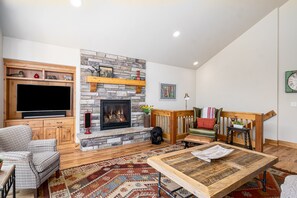 Living room view with fireplace and television