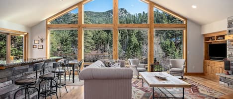 Picturesque views of the river and mountains from your living room.