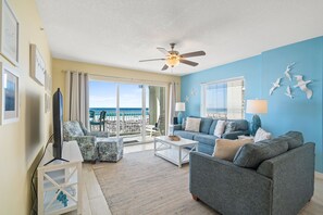 Living Room - Spacious and welcoming view of the living room and the balcony.