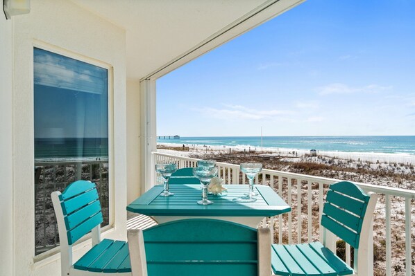 Balcony View - You can see white sandy beaches for miles! In this view you can see the pool & beach access entrance.