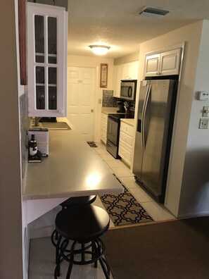 Kitchen door leads to garage