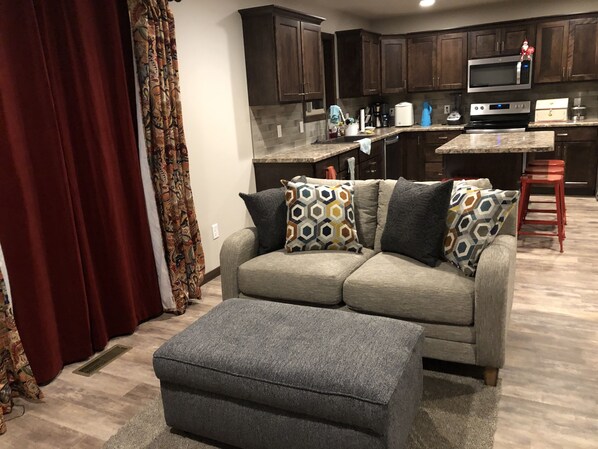 Small seating area on main level next to kitchen and dining room. 