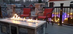 Gas firepit on balcony overlooking courtyard.