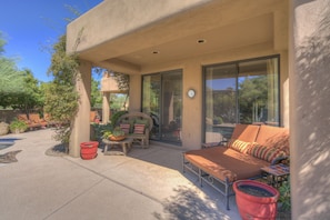 Master bedroom opens to poolside covered patio. 