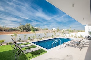 Garden with barbecue, seating area, sunloungers, shower and private pool