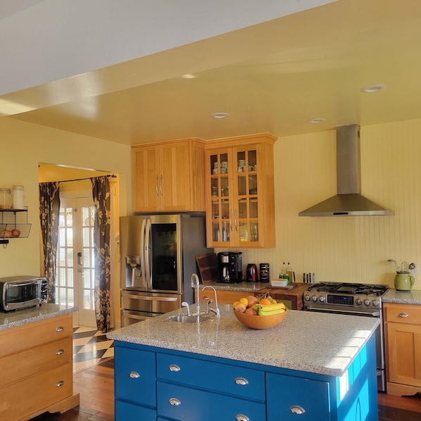 open , bright fully stocked kitchen 