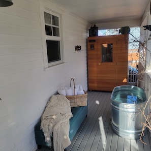 back porch area with infrared sauna and cold plunge therapy tub