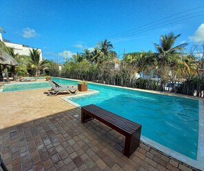 The large swimming pool is inviting you to get refreshed after a hot day spent a the beach