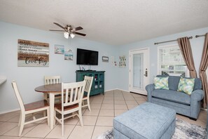 Spacious living area with flat screen TV to enjoy on the new cozy sofa