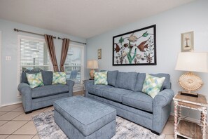 Chic and cozy gathering space with queen size sleeper sofa, the perfect ambience for unwinding after a day of fun in the sun